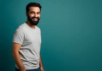 Fototapeta premium Smiling man portrait against teal background