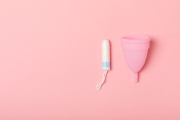 Menstrual cup on a bright background. Sanitary napkins, tampons and menstrual cup.Concept of critical days, menstruation.feminine hygiene product. Women health concept.Premenstrual syndrome.Copy space