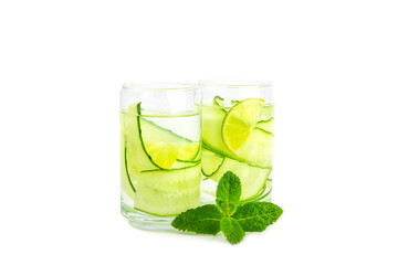 Cucumber water with lemon, lime and mint isolated on white background. Water infused with sliced ​​cucumber in a drinking glass. Tonic refreshing drink. Cucumber lemonade.Summer natural cooling drink
