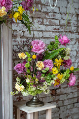 Colorful Floral Arrangement Against Rustic Brick Wall
