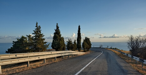 Russia, Republic of Crimea. View of the winding paved road along the Black Sea coast near the town...