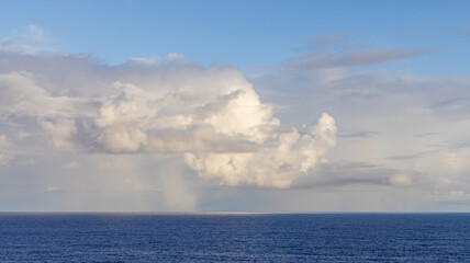 Majestic Clouds Over the Serene Pacific Ocean During a Clear Day