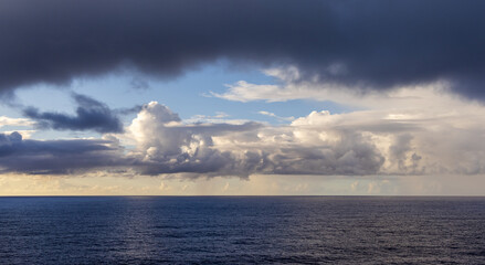 Dramatic Cloudscape Over the Expansive Pacific Ocean at Sunset