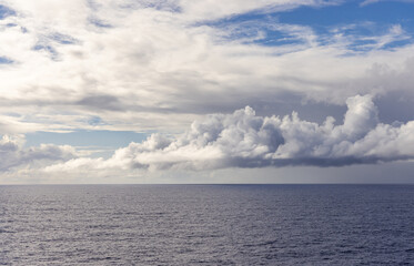 Serene Ocean View With Expansive Cloudscape Under Blue Sky