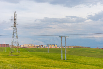 High voltage power lines in the field in Setif City, Algeria.
