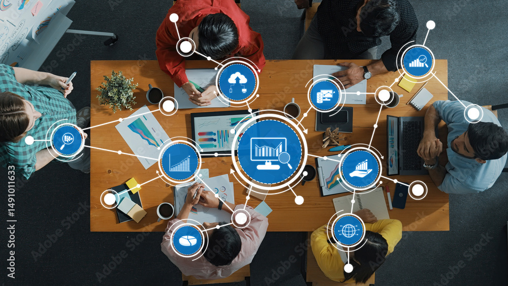 Poster professionals engage in a dynamic meeting from above, analyzing data and discussing strategies using