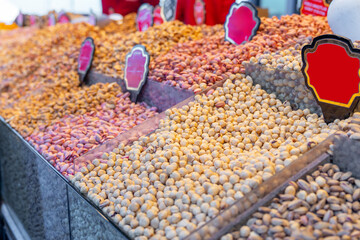 Pile of different kinds of nuts and other organic food on shop