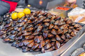 A lot of red mussels on sale in the store