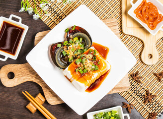 Century Egg Tofu served in plate isolated on wooden board top view of taiwan food