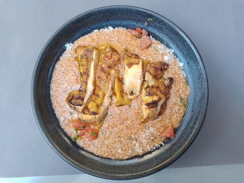 Chicken served with frumenty in a restaurant in Greece