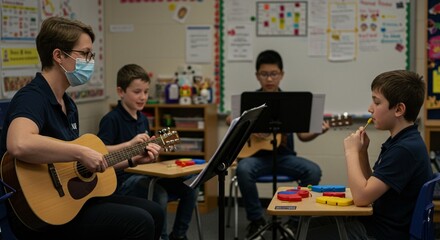 Masked teacher plays guitar instructing students learning music in classroom setting with sheet music and musical toys