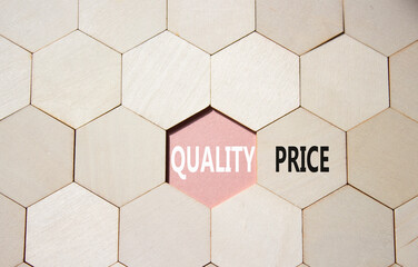 Price or Quality symbol. Concept word Price or Quality on wooden comb puzzle. Beautiful pink...