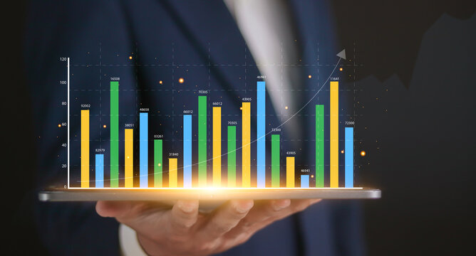 Business data analytics research concept, report graph dashboard monitor and financial investment planning. Businessman analyzing business data graphs on virtual screen.