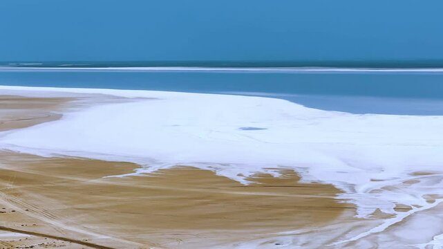 Lake Tuzbair in Kazakhstan. A salt lake near the Tuzbair mountains. Sor-Tuzbair is one of the wonders of Mangystau nature. Chalk hills and limestone cliffs. A salt marsh near the great Ustyurt plateau