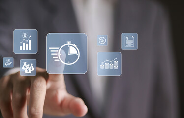 Investing money to grow in time, time is money concept. business time management. Businessman touching time management icon on virtual screen.