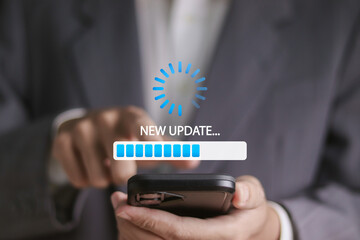 Software update or operating system concept, upgrades to keep your device up to date with enhanced functionality in new versions. Businessman using smartphone with update bar on virtual screen.