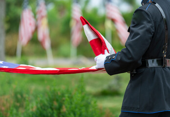 Color guard folding the US flag