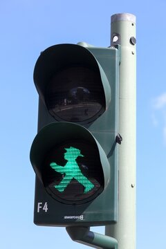 Berlin, Germany - July 13, 2020: Pedestrian green traffic light with the Ampelmann in Berlin