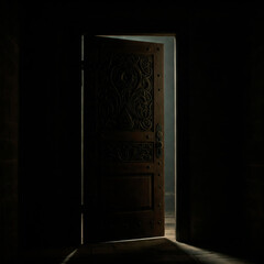 An old wooden door in the dark with a glimmer of light.