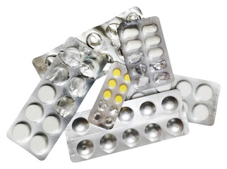 An overhead shot of various pharmaceutical blister packs, some full with white and yellow pills, others partially used or empty. The metallic foil packaging with distinct round and oval shapes suggest
