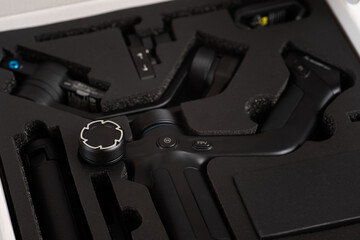 High-quality camera stabilizer placed in custom foam packaging for protection and storage in a secure box