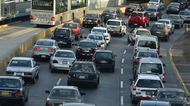LIMA PERU:View of San Isidro district skyline and freeway -via expresa -speed car at day