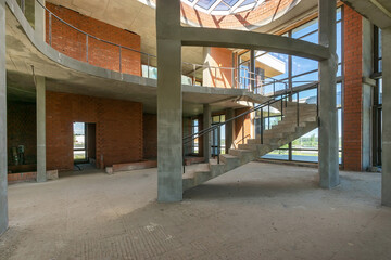 Modern design residential project in a luxury mansion under construction. Panoramic windows let in...