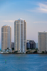 Obraz premium Brickell Key Miami. Aerial vertical photo of highrise condominium buildings waterfront at sunset