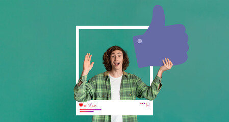A young adult with curly hair holds up a thumbs up gesture against a vibrant green background. They...