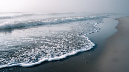 Fototapeta premium Ocean Waves Washing Ashore on a Misty Morning, Evoking Tranquility and Coastal Getaways, Perfect for Travel and Wellness Campaigns : Generative AI