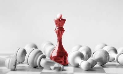 Black chess queen beats whites on chessboard over white background. Win and success concept, copy...