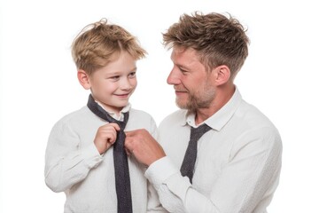 Father teaching his son to tie a tie, bonding moment, white background