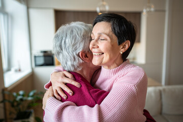 Joyful serene happy woman lovingly embraces husband, celebrating reunion after separation. Holiday greetings, strong family bonds, trust and warmth in relationship, emotional connection and support