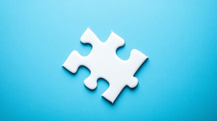 Obraz premium A single, glossy blue puzzle piece rests on a vibrant blue background.