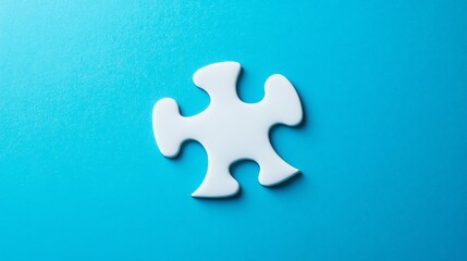 Obraz premium A single, white puzzle piece rests on a vibrant blue background.