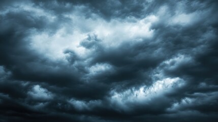 Obraz premium Dark and Ominous Stormy Clouds Across the Moody Sky Landscape