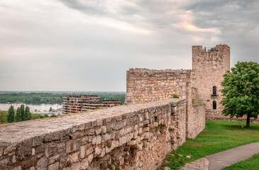 The walls and the ramparts of upper town of the Belgrade Fortress. The modern city of Belgrade and...