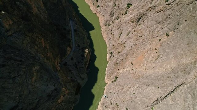 Person Jumping from Platform into Canyon Over River, Aerial Extreme Sports Scene
