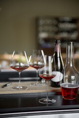 Decanter for sparkling wine on the table, Champagne tasting, Wine glasses and bottle, reflections, rose wine