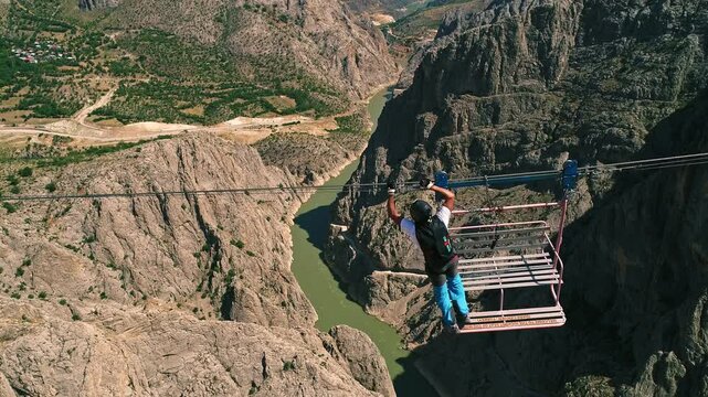 Extreme Jump from Canyon Platform into River with Parachute Deployment, Aerial View