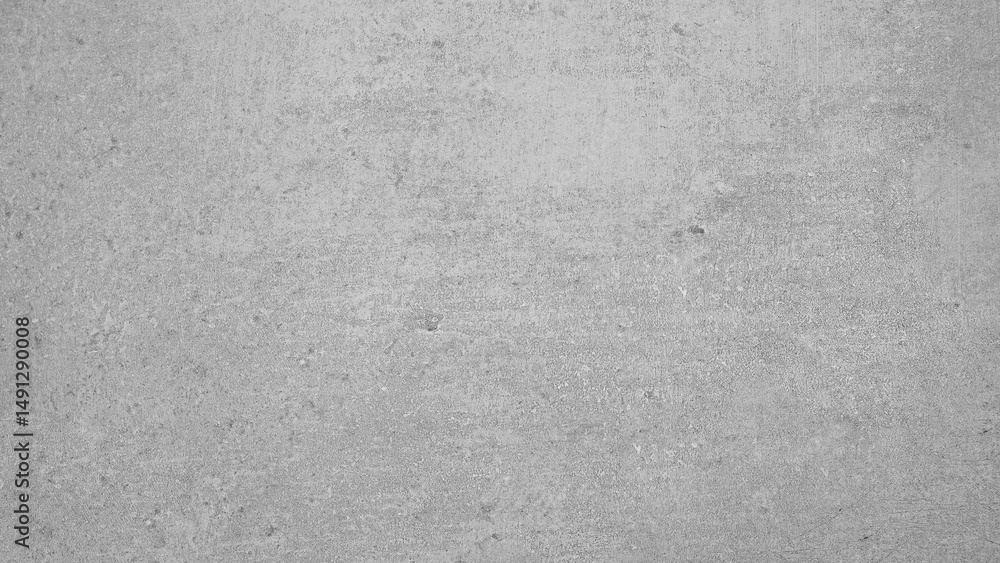 Poster a grey concrete wall with a few small cracks. the wall is very plain and unadorned abstract texture 