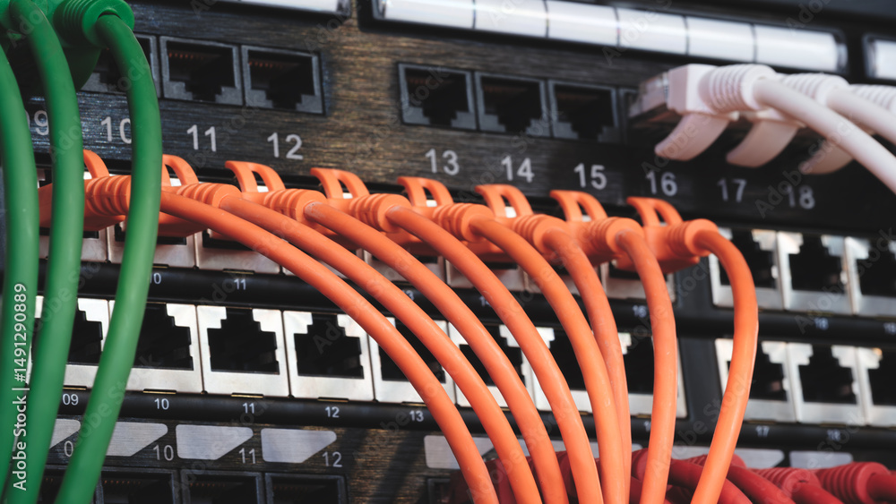 Poster a row of cables with different colors and numbers. the cables are connected to a black box. internet