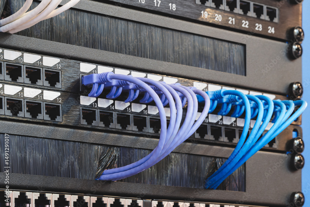 Poster a row of cables with different colors and numbers. the cables are connected to a black box. internet