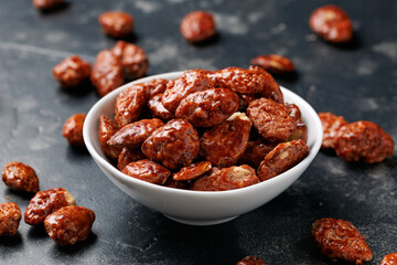Caramelized almonds. Toasted almonds coated with caramel syrup.