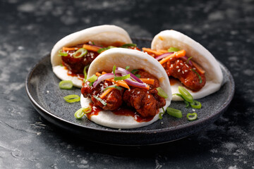 Korean Fried Chicken Bao Buns with vegetables. Asian fast food