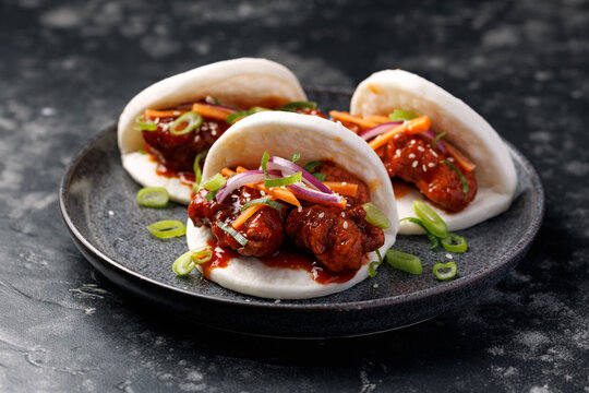 Korean Fried Chicken Bao Buns with vegetables. Asian fast food