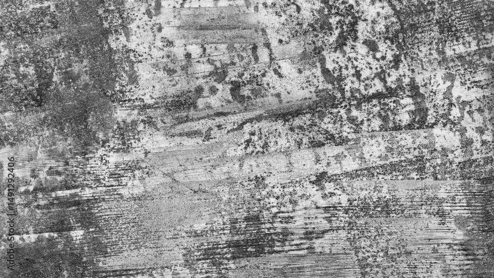 Aufkleber a grey and black background with a few white lines. the background is rough and has a lot of texture