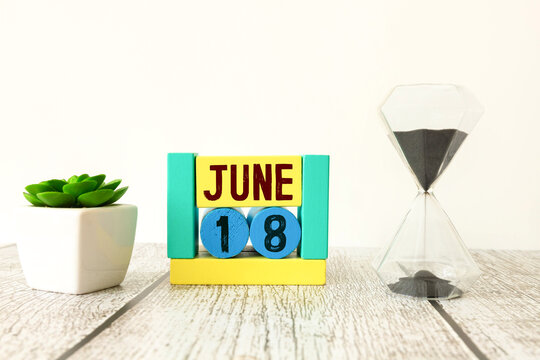 18 June wooden calendar with customizable space for text or ideas.
