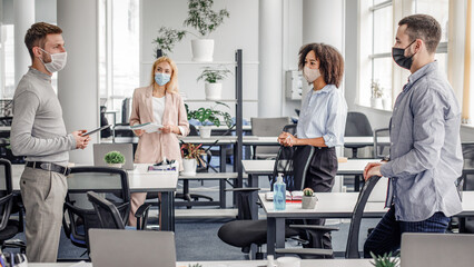 Urgent meeting of colleagues about creative ideas and business plans. Multiracial colleagues in...