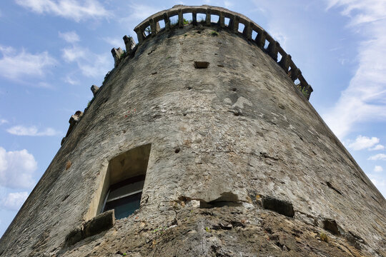 Bottom view of the historic medieval tower (Torre della Bruca) in the ancient archaeological complex of Velia (Elea), Cilento, Italy.